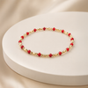 Red Bracelet with Gold Details